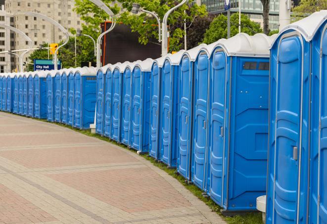 a row of portable restrooms ready for eventgoers in Golden Beach